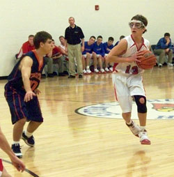 Seton Catholic High School basketball player Adam Schroeder directs his team’s offense during a Feb. 19 game at Chuck Mosey Memorial Gymnasium in Richmond. In the past five years, Seton Catholic has made great strides in developing a sports program for its students. (Submitted photo)