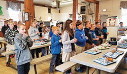 Students at St. Nicholas School in Ripley County pause from eating lunch to pray the Angelus at noon every day, one of the ways the Batesville Deanery school community lives its faith. (Submitted photo)