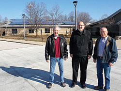 A statue of the Virgin Mary stands just below newly installed solar panels at St. John the Apostle Parish in Bloomington on March 15. Pope Francis has urged the world to use the Earth’s resources responsibly. (Photo by Katie Rutter) 