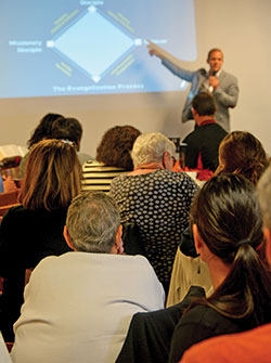 Members of parishes throughout central and southern Indiana listen and take notes as Tim Glemkowski of L’Alto Catholic Institute presents on evangelization during a workshop sponsored by the archdiocesan Office of Evangelization on Oct. 27, 2018, at St. Bartholomew Parish in Columbus. (File photo by Natalie Hoefer)