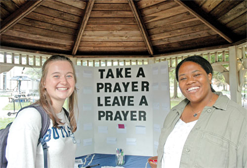 As the campus minister of the Catholic community at Butler University in Indianapolis, Cheyenne Johnson, right, has helped deepen the faith of the college’s Catholic students, including Ellie Cornn, a senior from St. Ambrose Parish in Seymour. (Photo by John Shaughnessy)