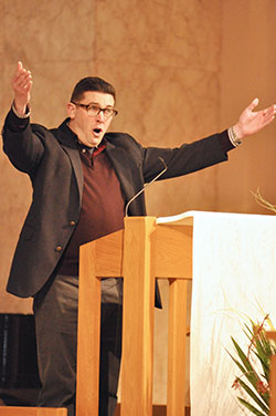 Person singing at the 2016 chrism Mass at the Cathedral